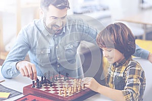 Chess competition between father and his little son