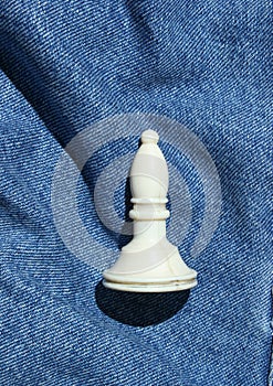 Chess figure on a jeans background.
