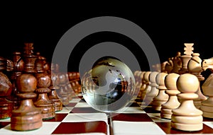 Chess figures against earth globe