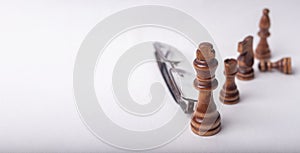 Chess figures with eyeglasse on white background