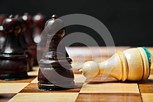 Chess figures on old wooden table