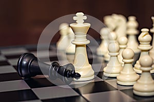 Chess game. Chess king is checkmated, chess game over photo