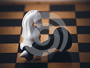 Chess game. Chess pieces on the game board. White and black. Tactical competition. Concept of a successful team work leader.