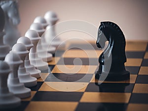 Chess game. Chess pieces on the game board. White and black. Tactical competition. Concept of a successful team work leader.