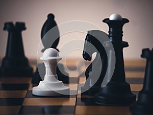 Chess game. Chess pieces on the game board. White and black. Tactical competition. Concept of a successful team work leader.