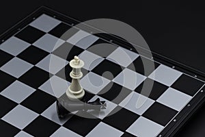 Chess game finish on chessboard. Victorious and defeated king figure. Chess figurine order. Checkmate game banner