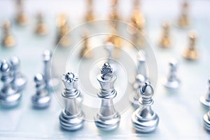 Chess game. A king stand determinedly among the enemies. Business competitive concept