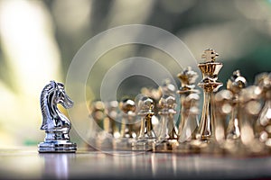 Chess game. A knight stand determinedly among the enemies. Business competitive concept