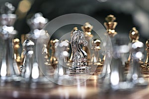 Chess game. A knight stand determinedly among the enemies. Business competitive concept