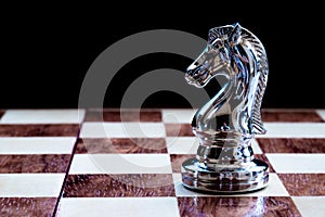 Chess game. A knight waiting for the right time to move. Business strategy and competitive concept