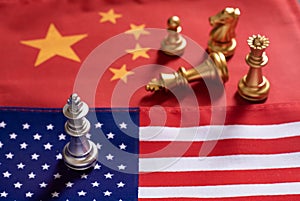 Chess game, one king stand as winner over the other on China and US national flags. Trade war concept. Conflict between two big