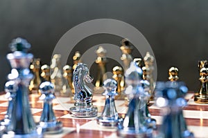 Chess game. Pawn stand determinedly against the enemies. Business competitive concept