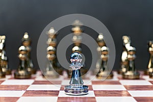 Chess game. Pawn stand determinedly against the enemies. Business competitive concept