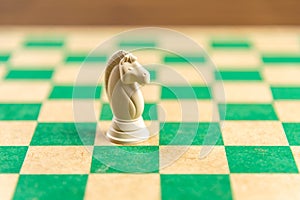 Chess game pieces on the green board