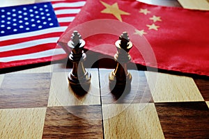 Chess game. Two kings face to face on Chinese and American national flags. Trade war and conflict between two big countries. USA