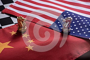 Chess game, two knights face to face on China and US national flags. Trade war concept. Conflict between two big countries, USA