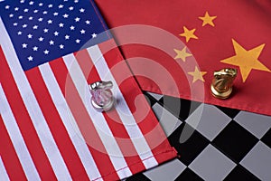 Chess game, two knights face to face on China and US national flags. Trade war concept. Conflict between two big countries, USA