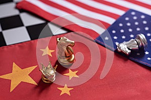 Chess game, two knights face to face on China and US national flags. Trade war concept. Conflict between two big countries, USA