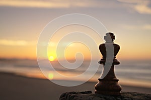 Chess King on Beach at Sunset