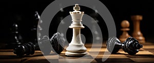 The chess king stands proudly amidst fallen pieces in a dramatic setting. AI generated image