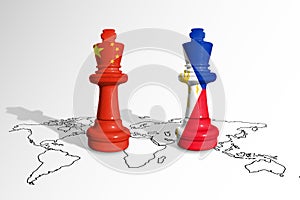 Chess made from China and Philippine flags on a world map