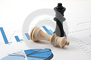 Chess man over business chart photo