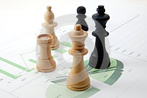 Chess man over business chart photo