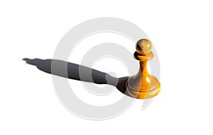 Chess pawn casting a king piece shadow concept of strength and