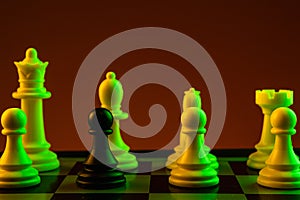 Chess pieces, Black pawn white pieces of silver on a chessboard, game. Concept of spy, espionage, confrontation, career,