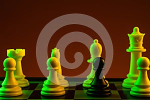 Chess pieces, Black pawn white pieces of silver on a chessboard, game. Concept of spy, espionage, confrontation, career,