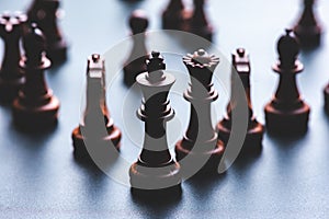 Chess pieces board game in business success leadership concept