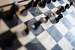 Chess pieces on the chess board with selective focus and crop fragment. Business and motivation concept