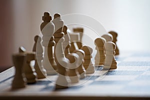 Chess pieces on the chess board with selective focus and crop fragment. Business and motivation concept