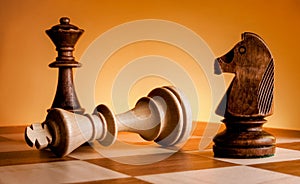 Chess pieces on a chessboard. Game of chess. Mat to the king