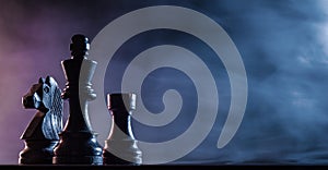 Chess pieces on a dark background