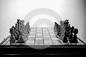 Chess pieces before the game. Chess board on the table
