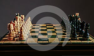 Chess pieces before the game. Chess board on the table