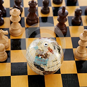 Chess pieces and globe