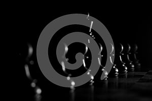 Chess pieces illuminated in the dark