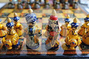 Chess pieces made in traditional Tajik style dressed in folk costumes