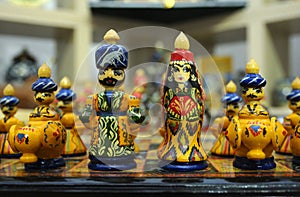 Chess pieces made in traditional Tajik style dressed in folk costumes