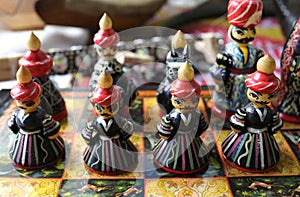 Chess pieces made in traditional Tajik style in folk costumes