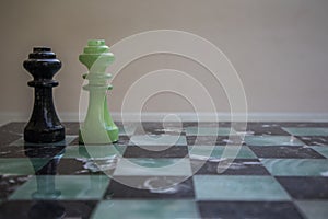 Chess pieces on a marble chessboard