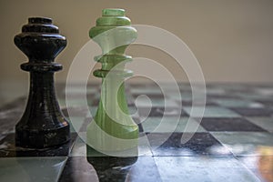 Chess pieces on a marble chessboard