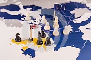 Chess pieces over an european map. Brexit concept