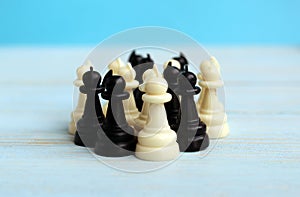 Chess pieces of a pawn stand in one heap
