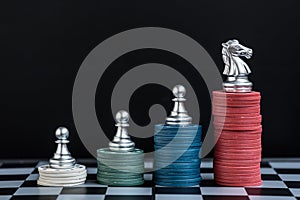 Chess pieces on stack of casino chips