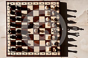 Chess pieces on a table in the park