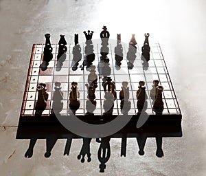 Chess pieces on a table in the park