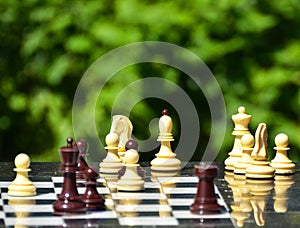 Chess pieces on a table in the park